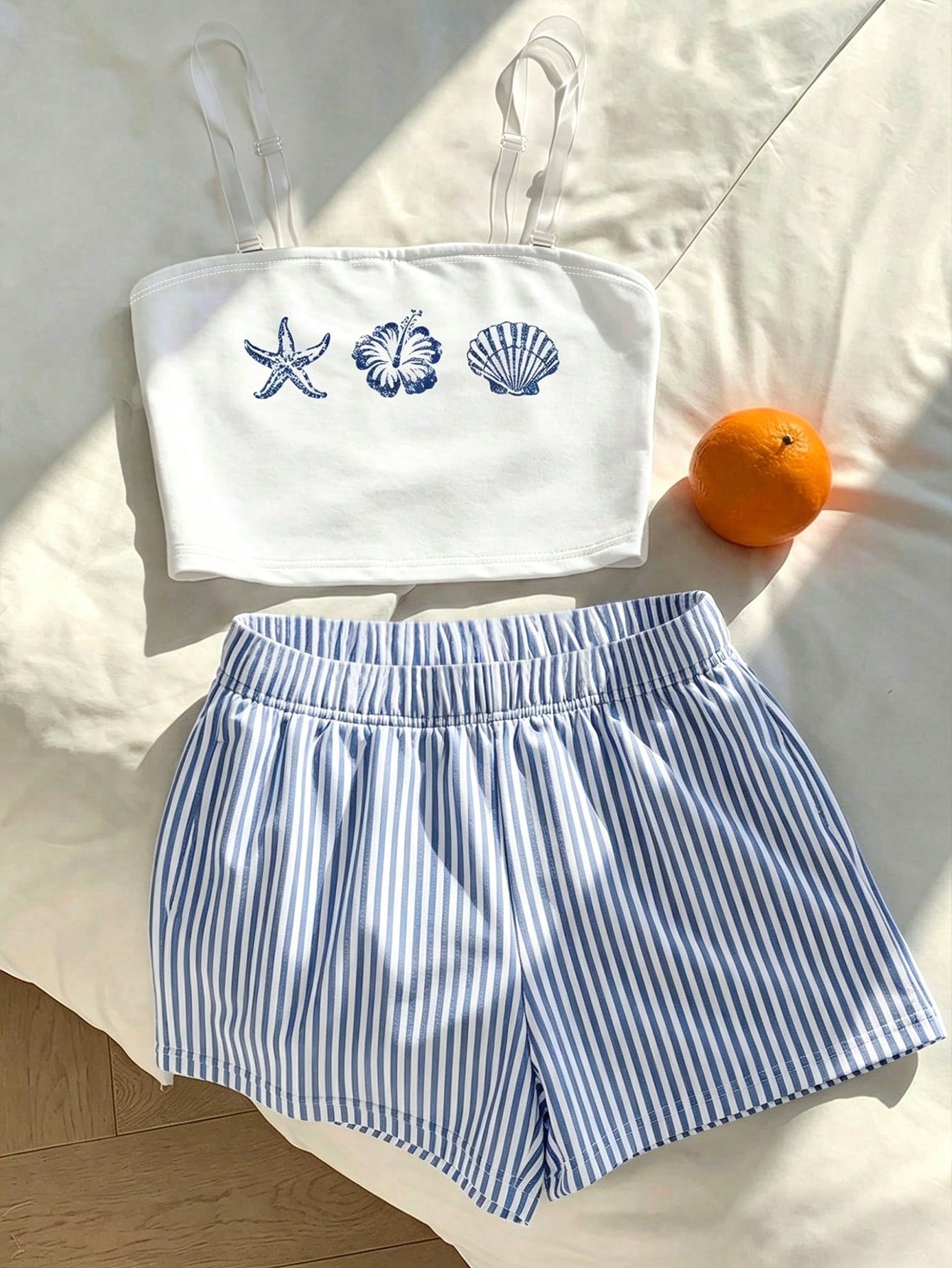 Tween girls two-piece summer outfit featuring a brown strapless tube top with contrast pink tape accent and matching brown shorts with pockets.