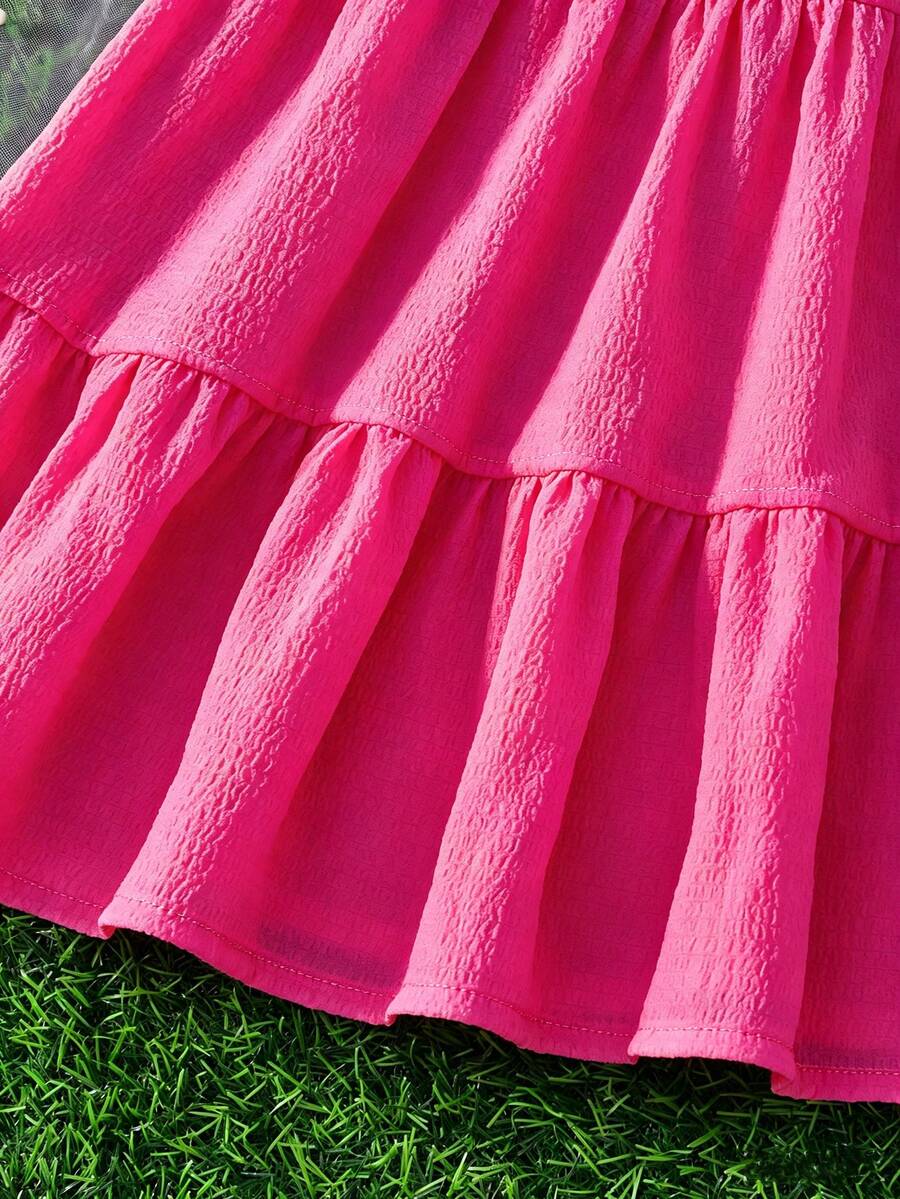 Tween girls yellow sleeveless cami dress with spaghetti straps, high waist, tiered layered skirt, shirred detail, zipper closure, and casual vacation style.