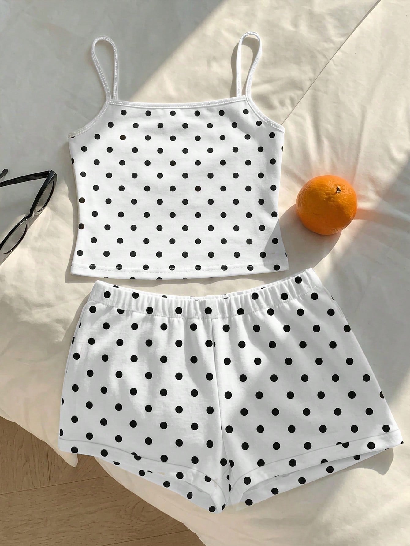 Tween girls summer 2-piece Hawaiian style outfit featuring a graphic print spaghetti strap camisole top with contrast piping and matching casual shorts.