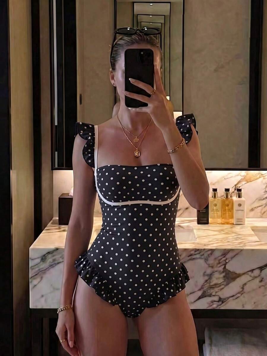 Black colorblock women's one-piece swimsuit with spaghetti straps and high stretch fabric.