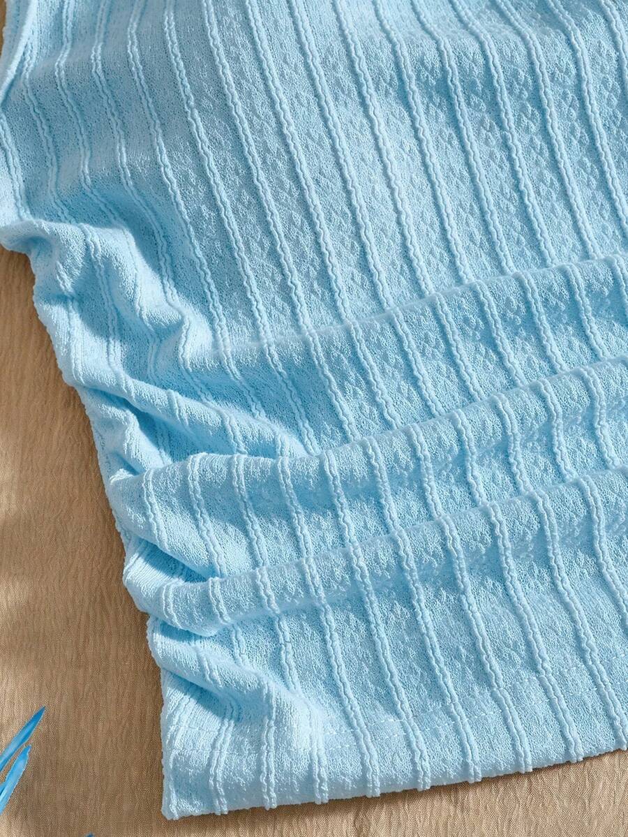 Light blue two-piece outfit set for tween girls with a sleeveless round neck vest top and a tiered ruffle cake skirt featuring a plant pattern.