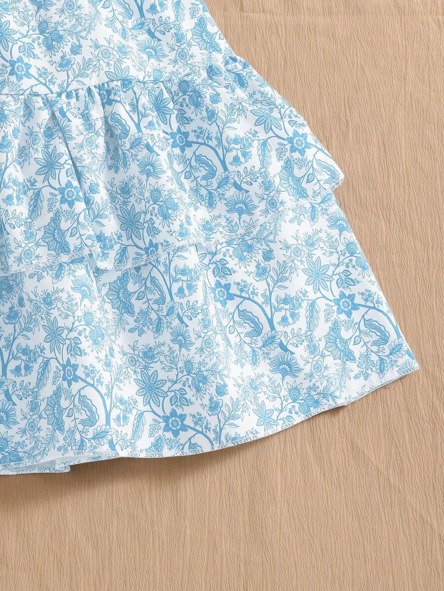 Light blue two-piece outfit set for tween girls with a sleeveless round neck vest top and a tiered ruffle cake skirt featuring a plant pattern.