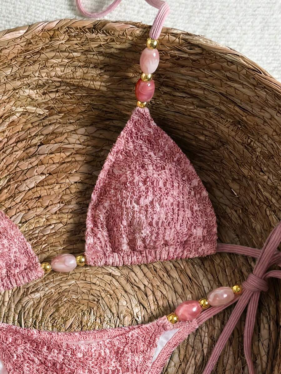 Multicolor textured beaded halter bikini set for women featuring wireless triangle cups with removable padding and ultra low waist tie side bottoms.