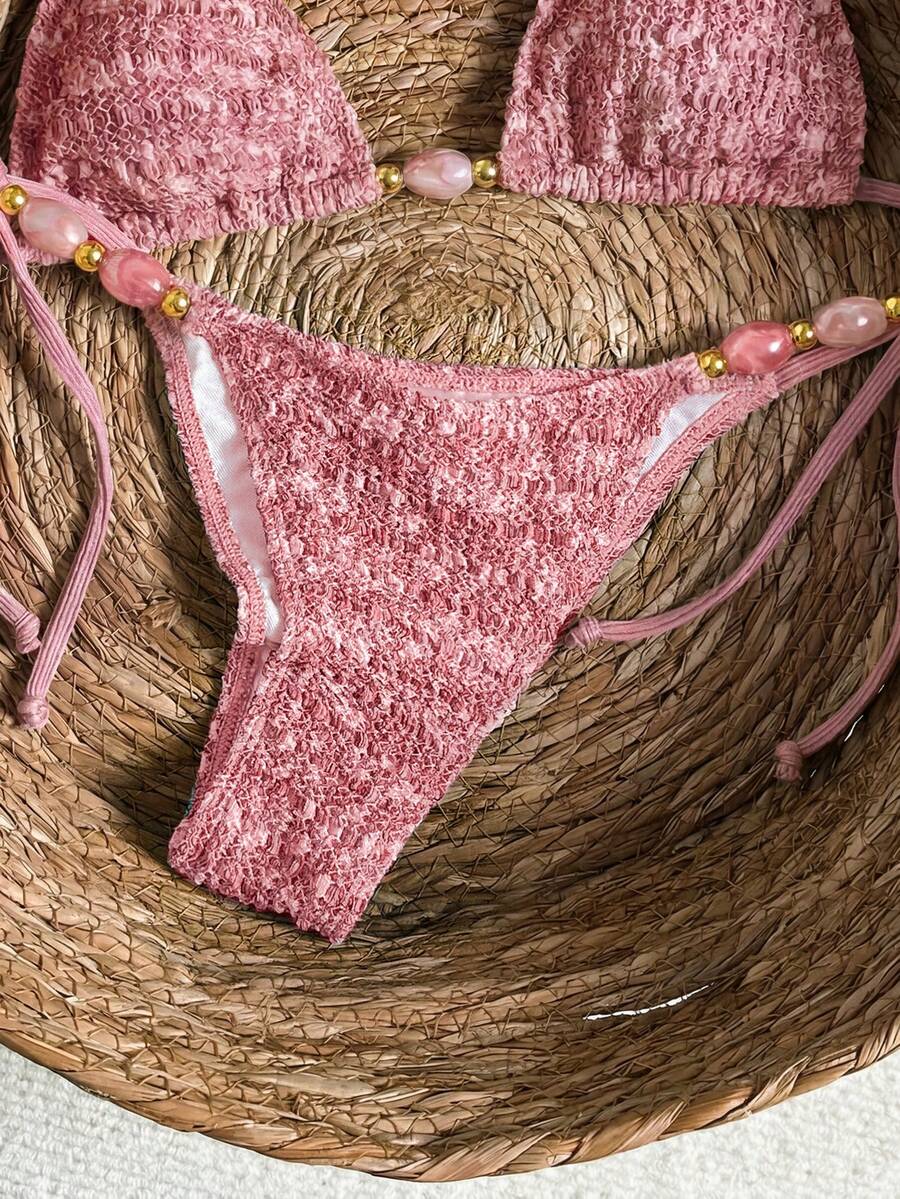 Multicolor textured beaded halter bikini set for women featuring wireless triangle cups with removable padding and ultra low waist tie side bottoms.