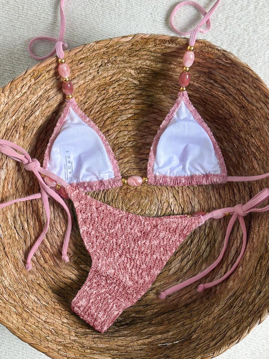 Multicolor textured beaded halter bikini set for women featuring wireless triangle cups with removable padding and ultra low waist tie side bottoms.