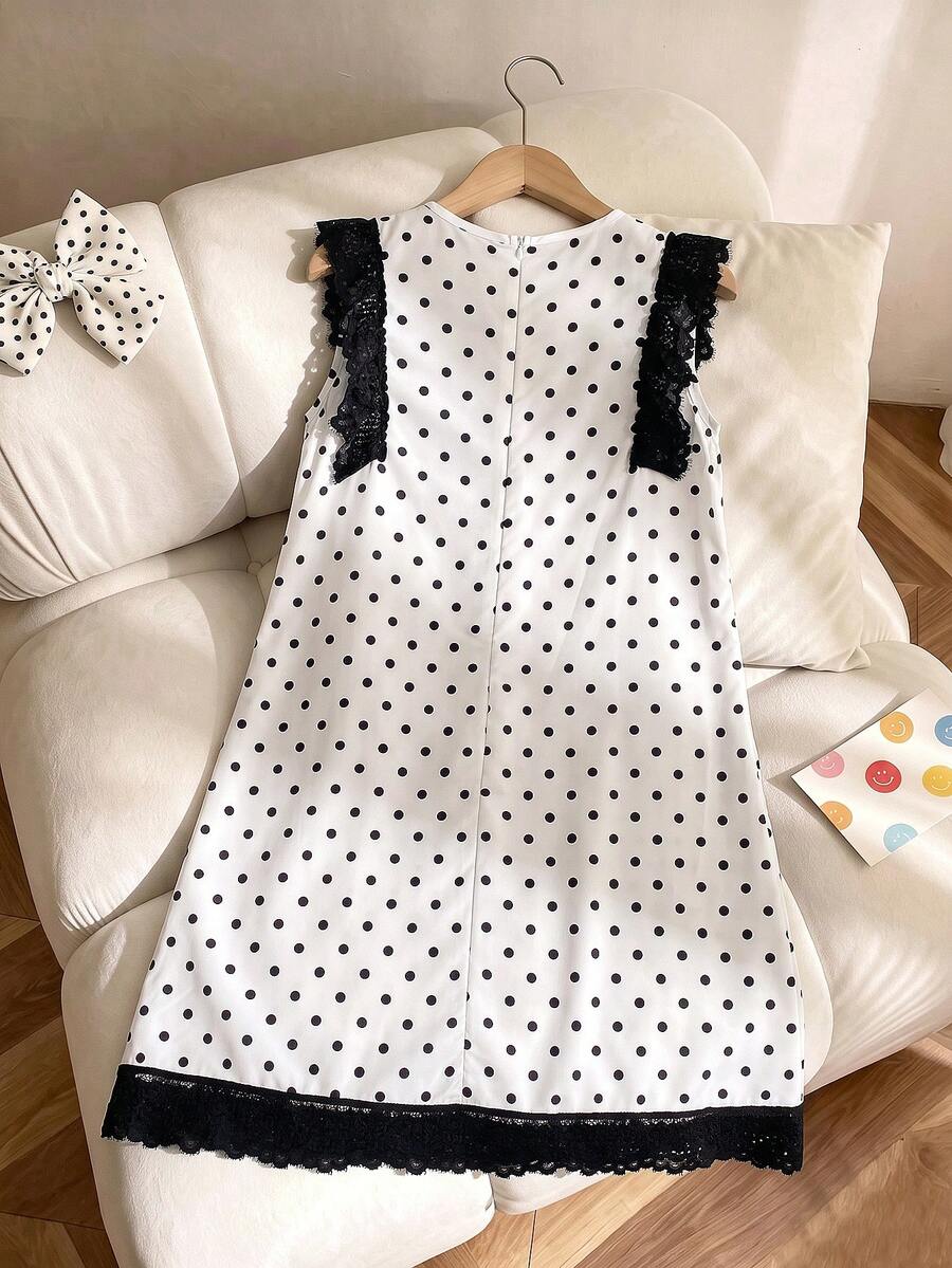 Tween girls apricot vacation midi dress featuring a round neck, cut out details, ruffle flounce accents, and geometric pattern.