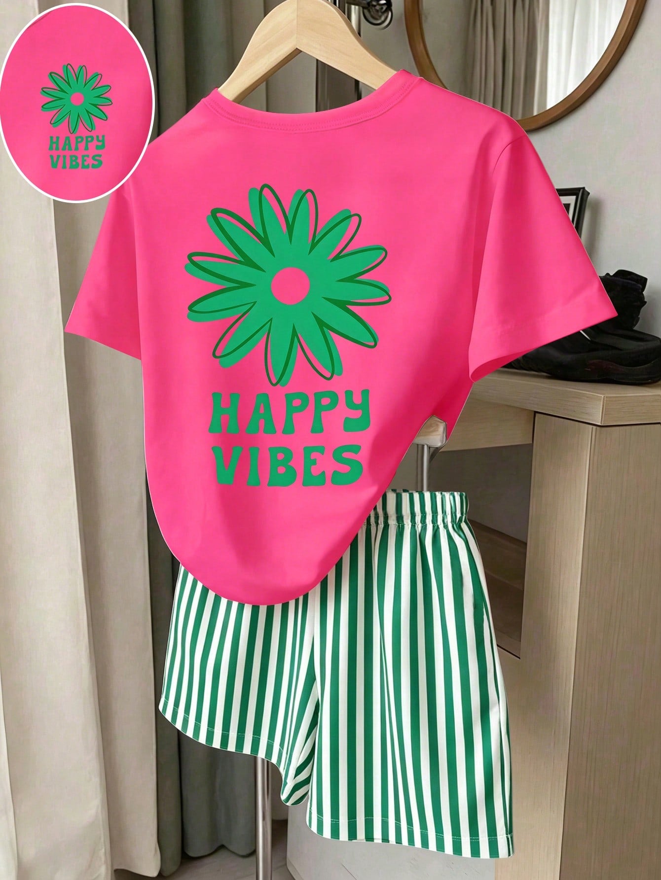 Girls' multicolor short sleeve T-shirt and shorts set featuring a cute cherry and bow print with round neck top and matching shorts.