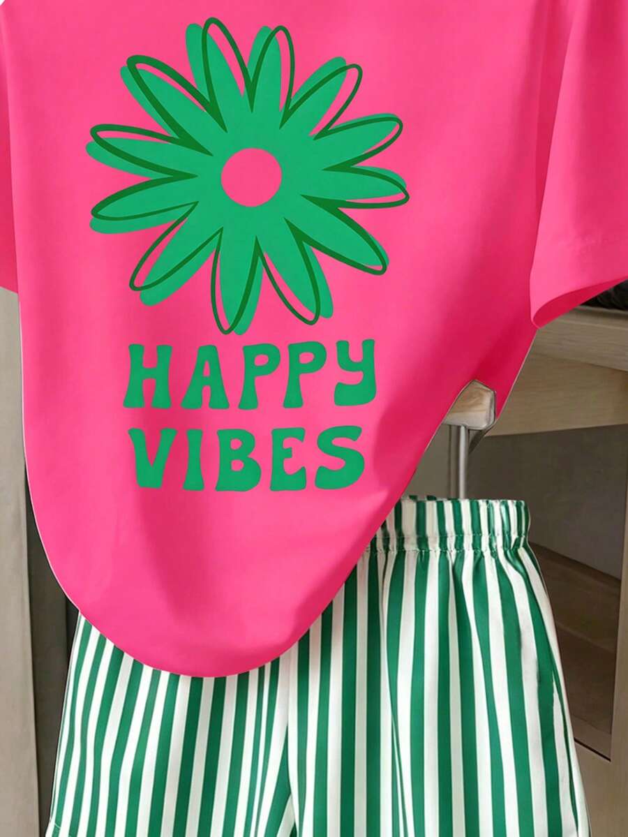 Girls' multicolor short sleeve T-shirt and shorts set featuring a cute cherry and bow print with round neck top and matching shorts.