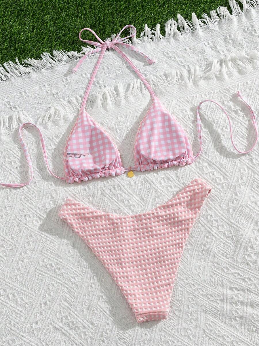 Women's black textured plaid 2-piece bikini set featuring a halter neckline, wireless triangle cups with removable padding, and mid-waist bottoms.