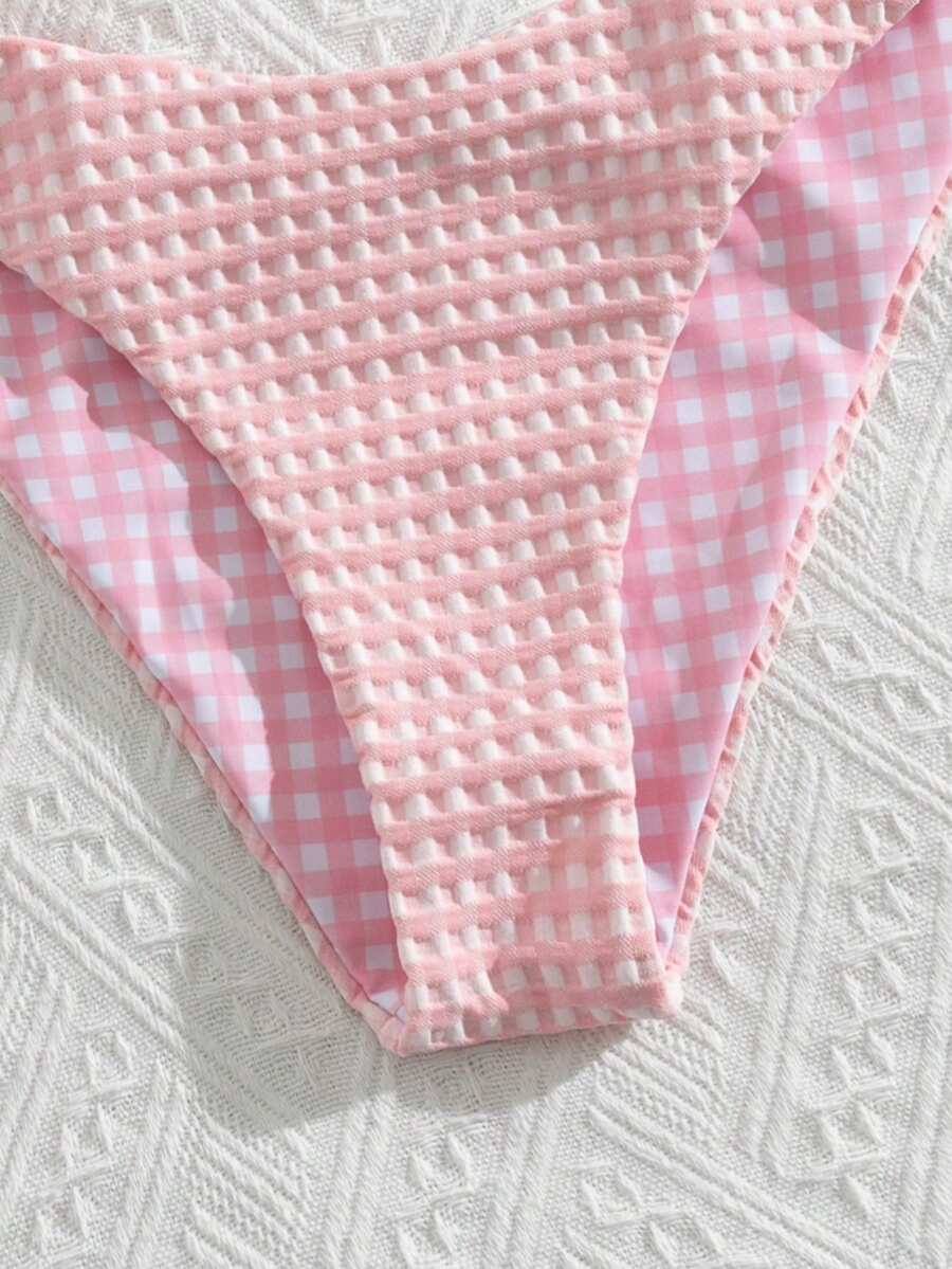Women's black textured plaid 2-piece bikini set featuring a halter neckline, wireless triangle cups with removable padding, and mid-waist bottoms.