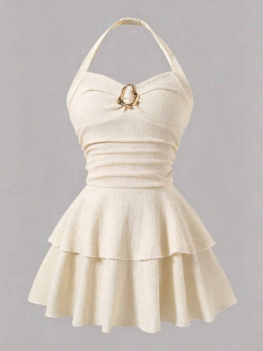 Tween girls apricot sleeveless halter mini dress with textured starfish and shell decor, shirred tiered layer, high waist, and flounce hem.
