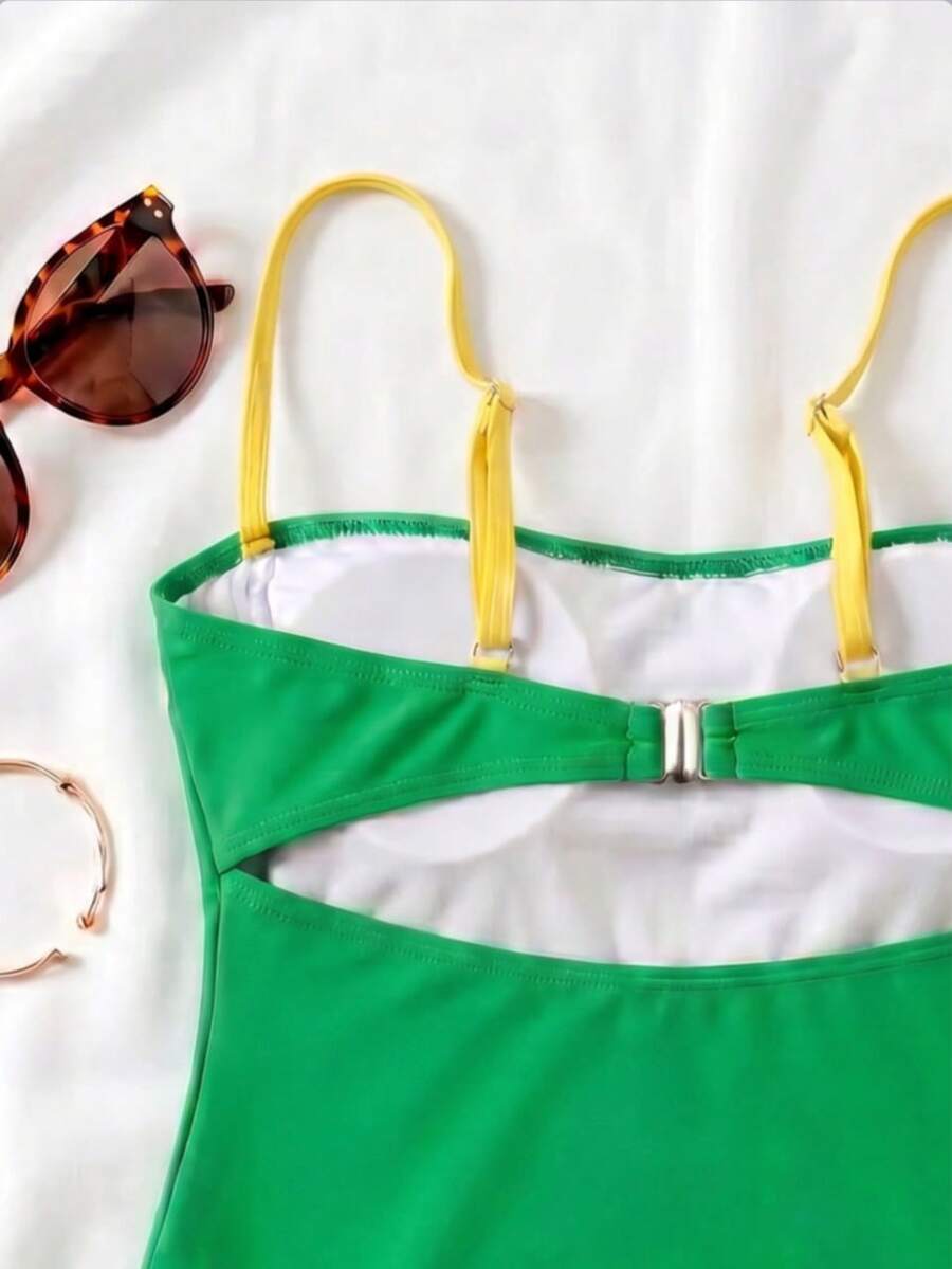 Black colorblock women's one-piece swimsuit with spaghetti straps and high stretch fabric.