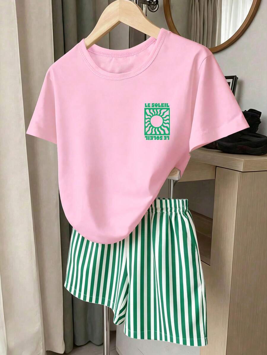 Girls' multicolor short sleeve T-shirt and shorts set featuring a cute cherry and bow print with round neck top and matching shorts.