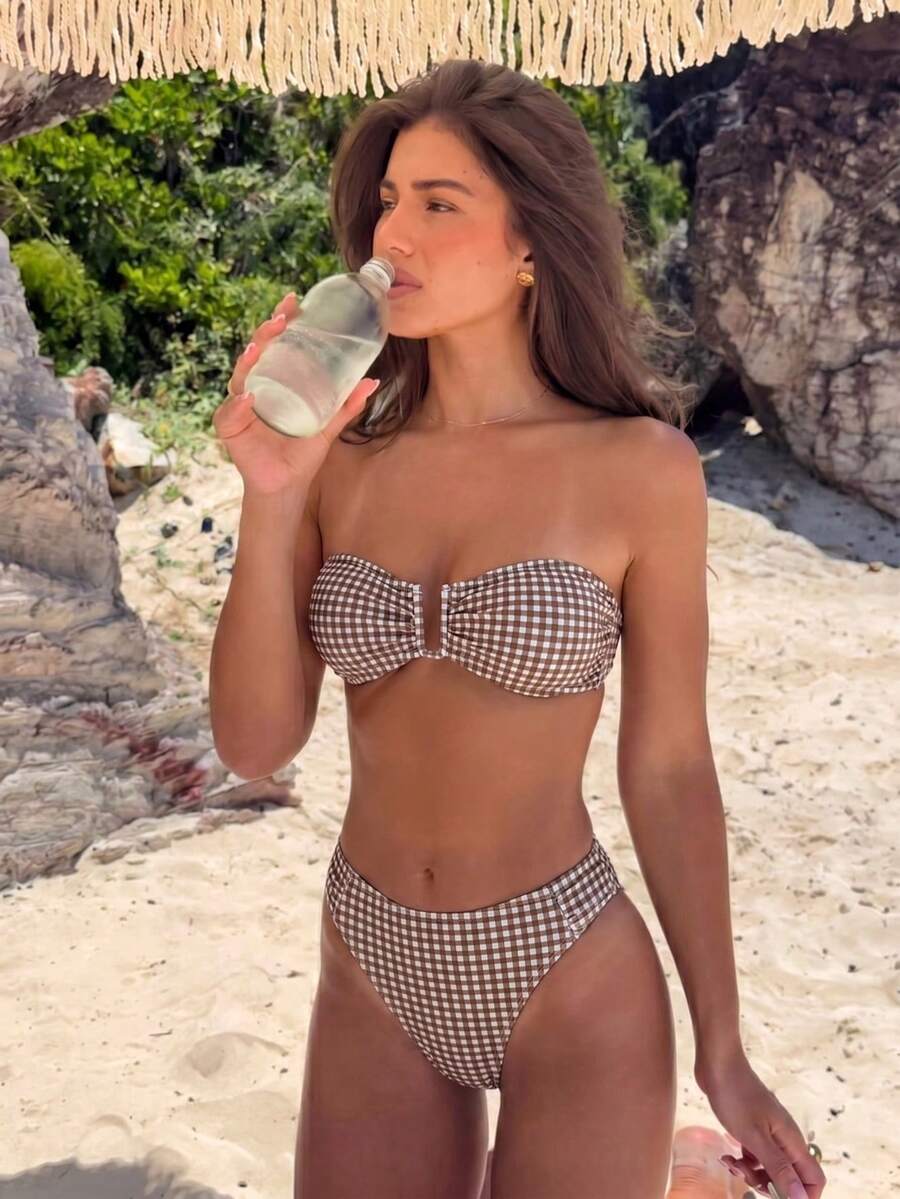 Brown and white small plaid two-piece bikini set featuring a strapless ruched bustier top with back tie and high-waist bottoms.