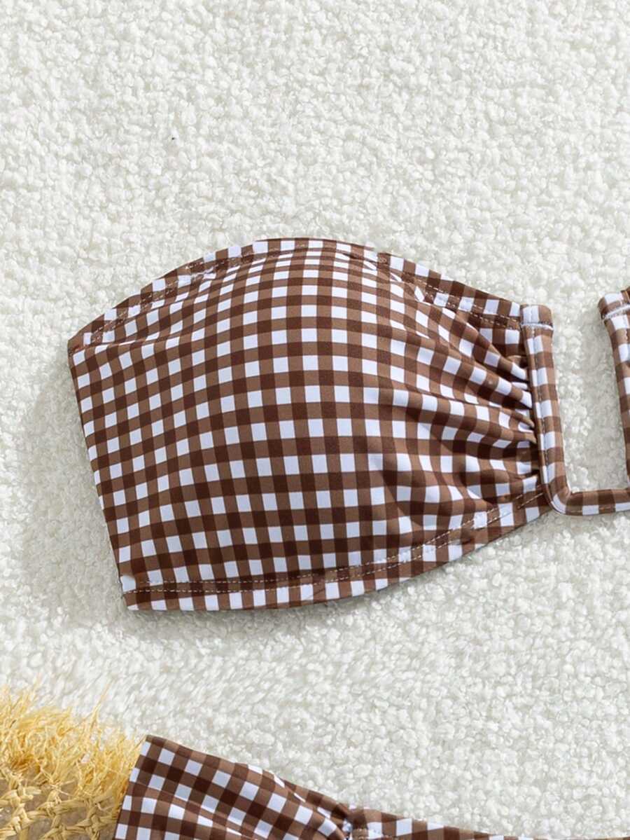 Brown and white small plaid two-piece bikini set featuring a strapless ruched bustier top with back tie and high-waist bottoms.