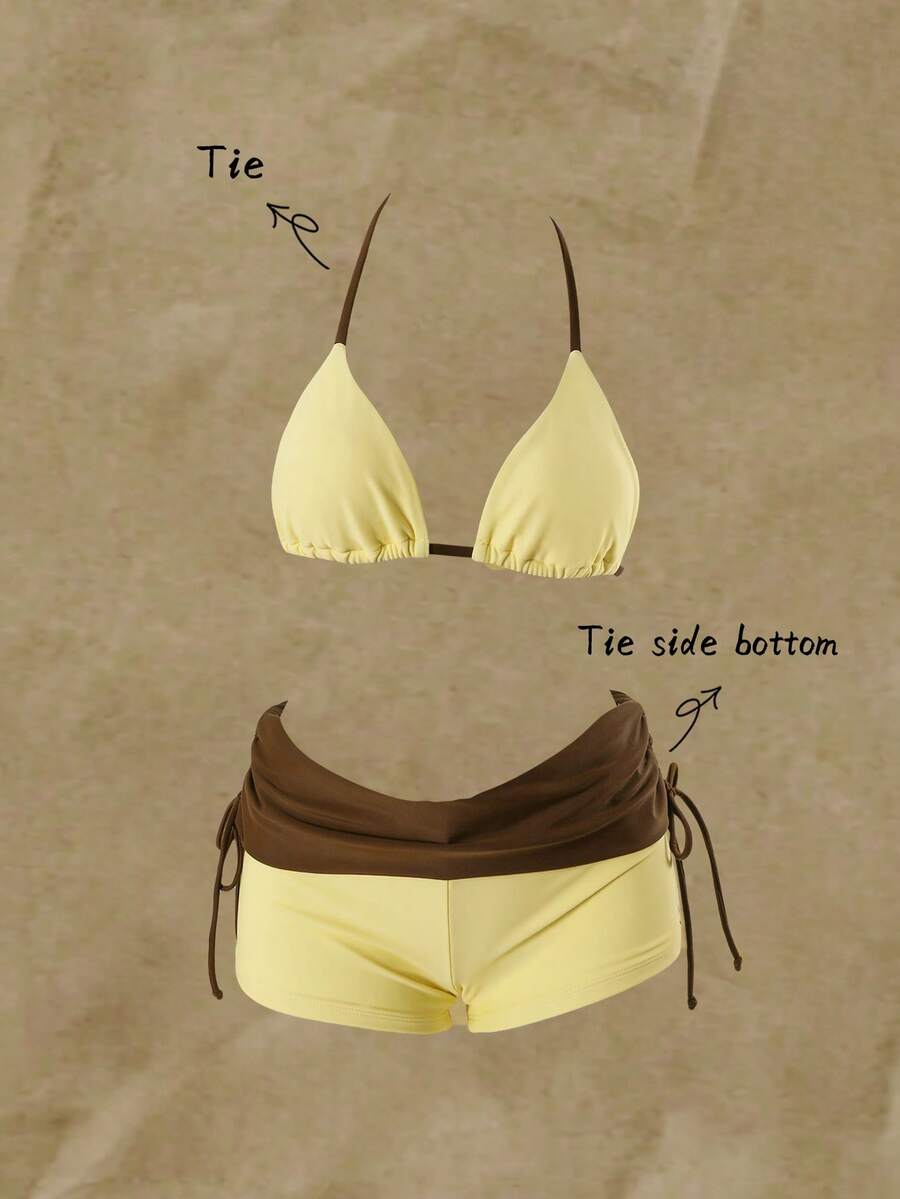 Women's halter triangle bikini top with knot detail paired with mid-waist colorblock swim shorts.
