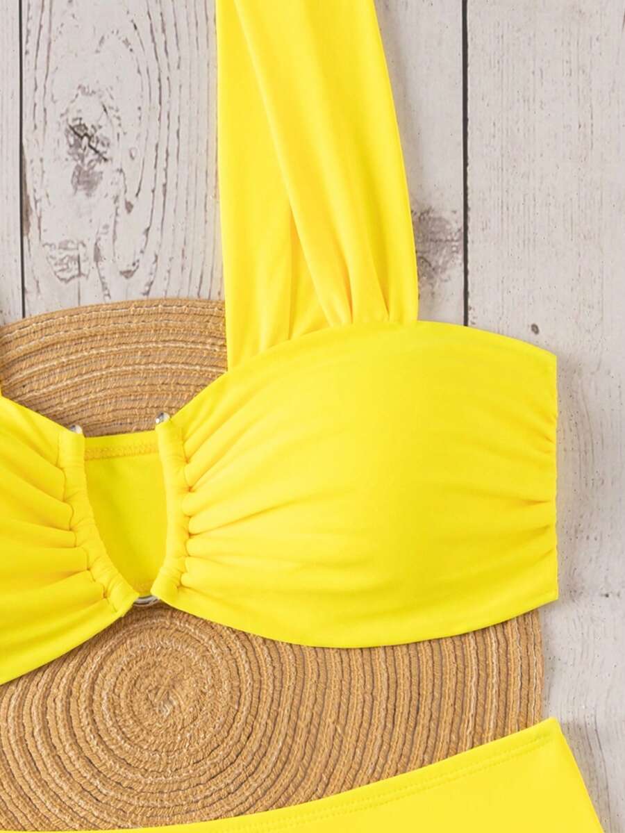 Springbreak black high waist bikini set for women featuring wireless bra top with ruffle lettuce trim and V-wired detail.