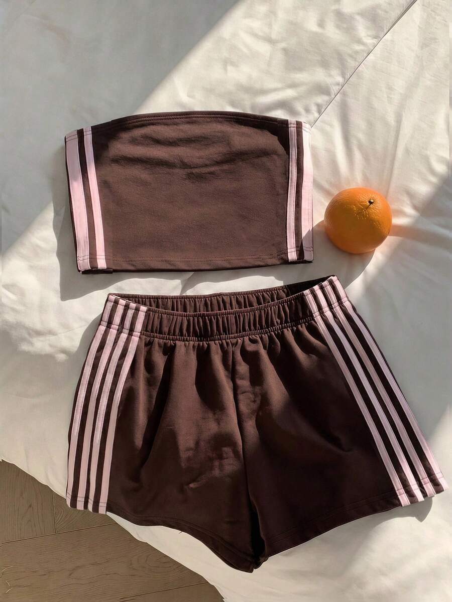 Tween girls two-piece summer outfit featuring a brown strapless tube top with contrast pink tape accent and matching brown shorts with pockets.