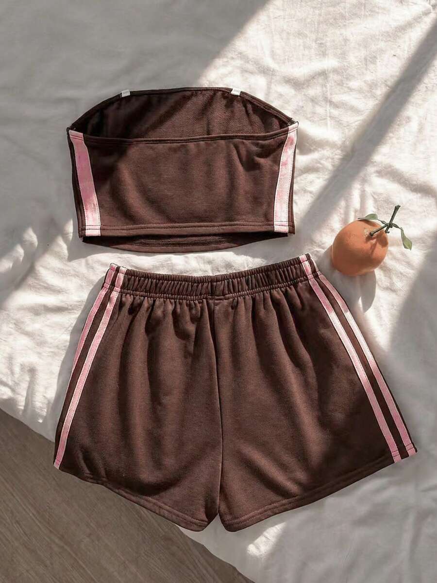 Tween girls two-piece summer outfit featuring a brown strapless tube top with contrast pink tape accent and matching brown shorts with pockets.