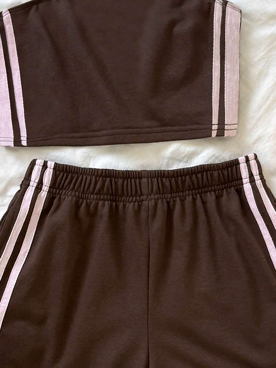 Tween girls two-piece summer outfit featuring a brown strapless tube top with contrast pink tape accent and matching brown shorts with pockets.
