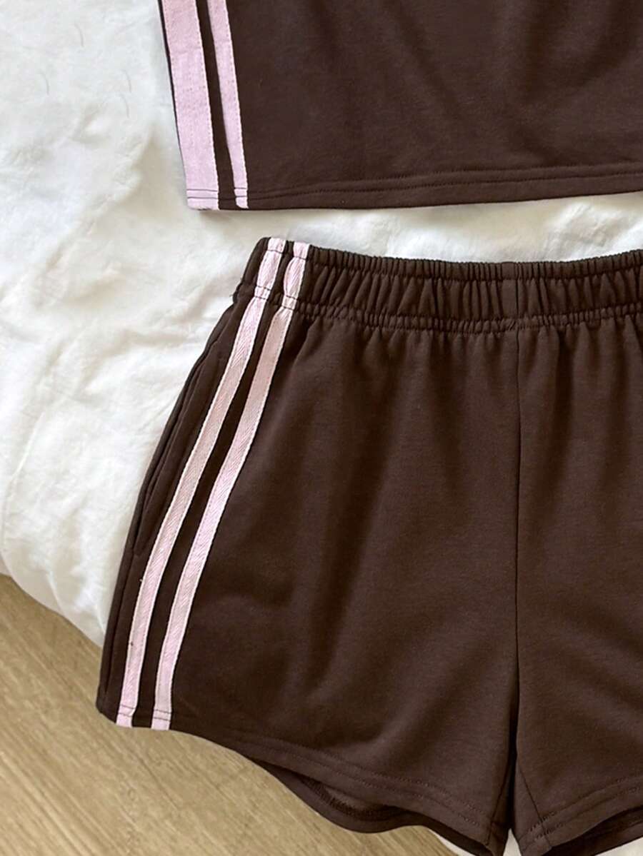 Tween girls two-piece summer outfit featuring a brown strapless tube top with contrast pink tape accent and matching brown shorts with pockets.