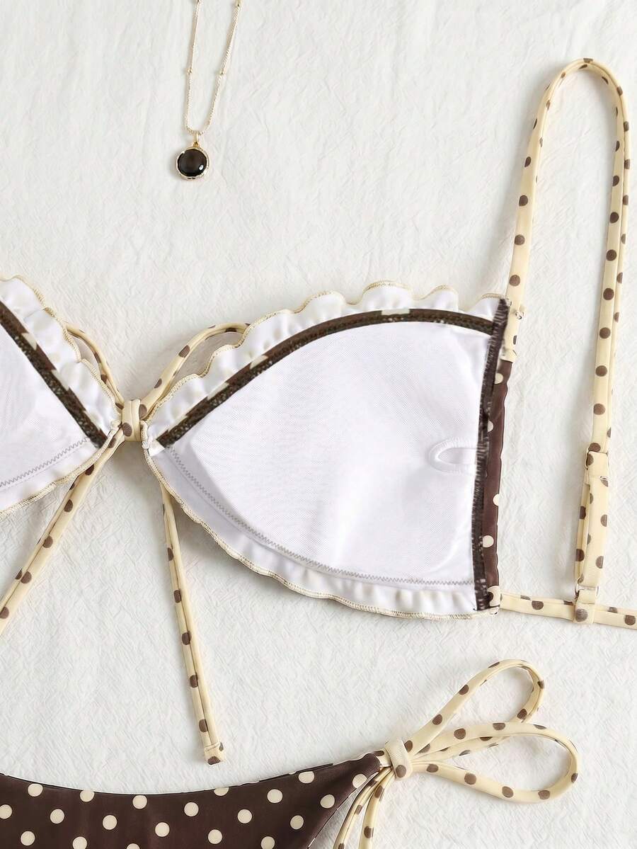 Women's beige two-piece bikini set featuring a wireless top with removable padding, spaghetti straps, tie back detail, and low waist hipster swimsuit bottoms.