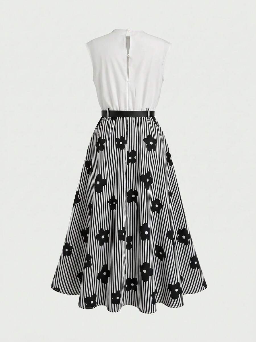 Tween girl wearing an apricot plant print sleeveless A-line long dress with a round neckline and flared skirt.