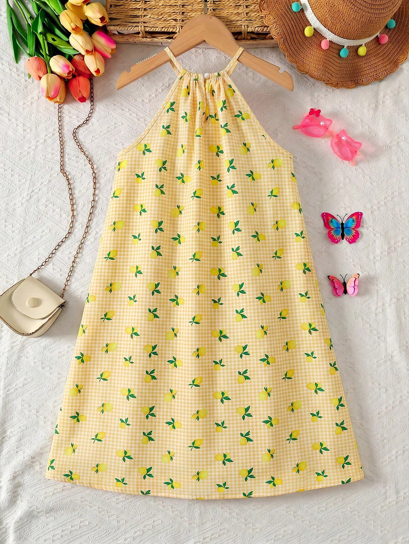 Tween girls sleeveless halter tunic dress with colorful rainbow striped colorblock pattern, button detail, short length, and regular fit for summer vacation or beach wear.