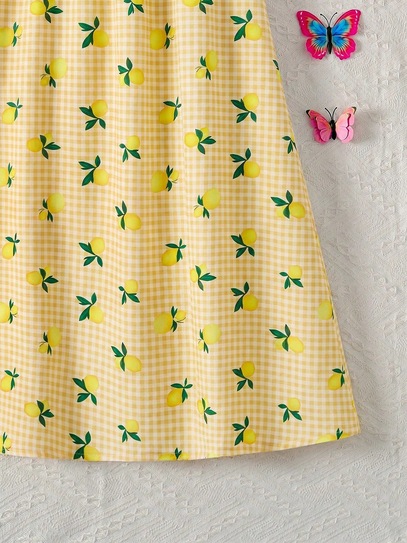 Tween girls sleeveless halter tunic dress with colorful rainbow striped colorblock pattern, button detail, short length, and regular fit for summer vacation or beach wear.