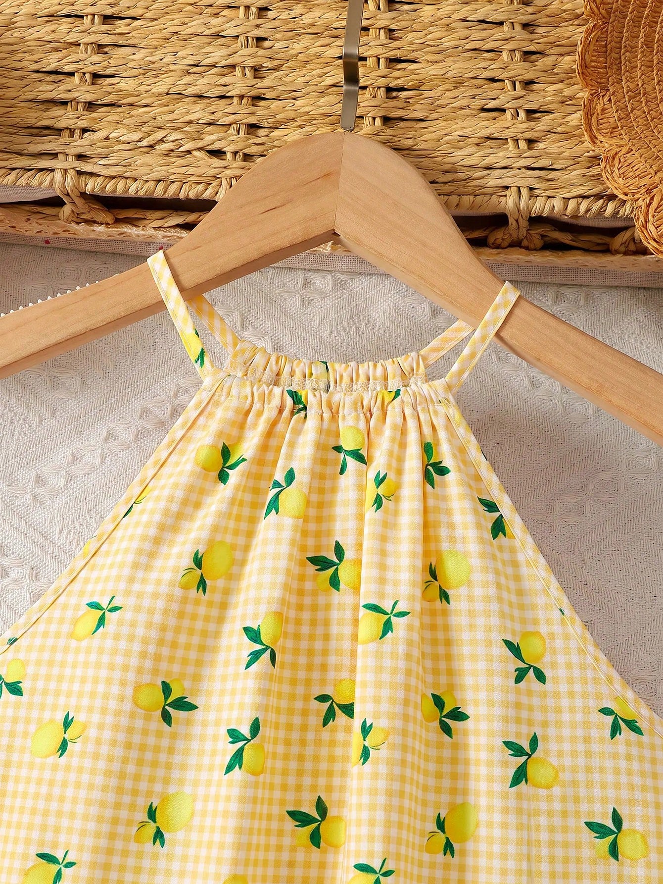 Tween girls sleeveless halter tunic dress with colorful rainbow striped colorblock pattern, button detail, short length, and regular fit for summer vacation or beach wear.