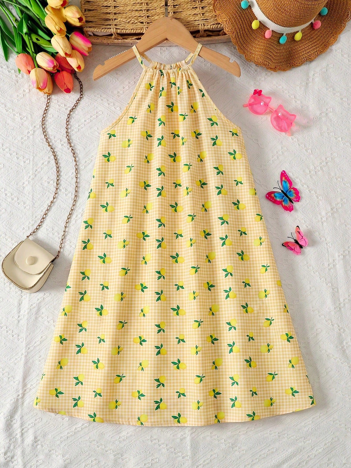 Tween girls sleeveless halter tunic dress with colorful rainbow striped colorblock pattern, button detail, short length, and regular fit for summer vacation or beach wear.