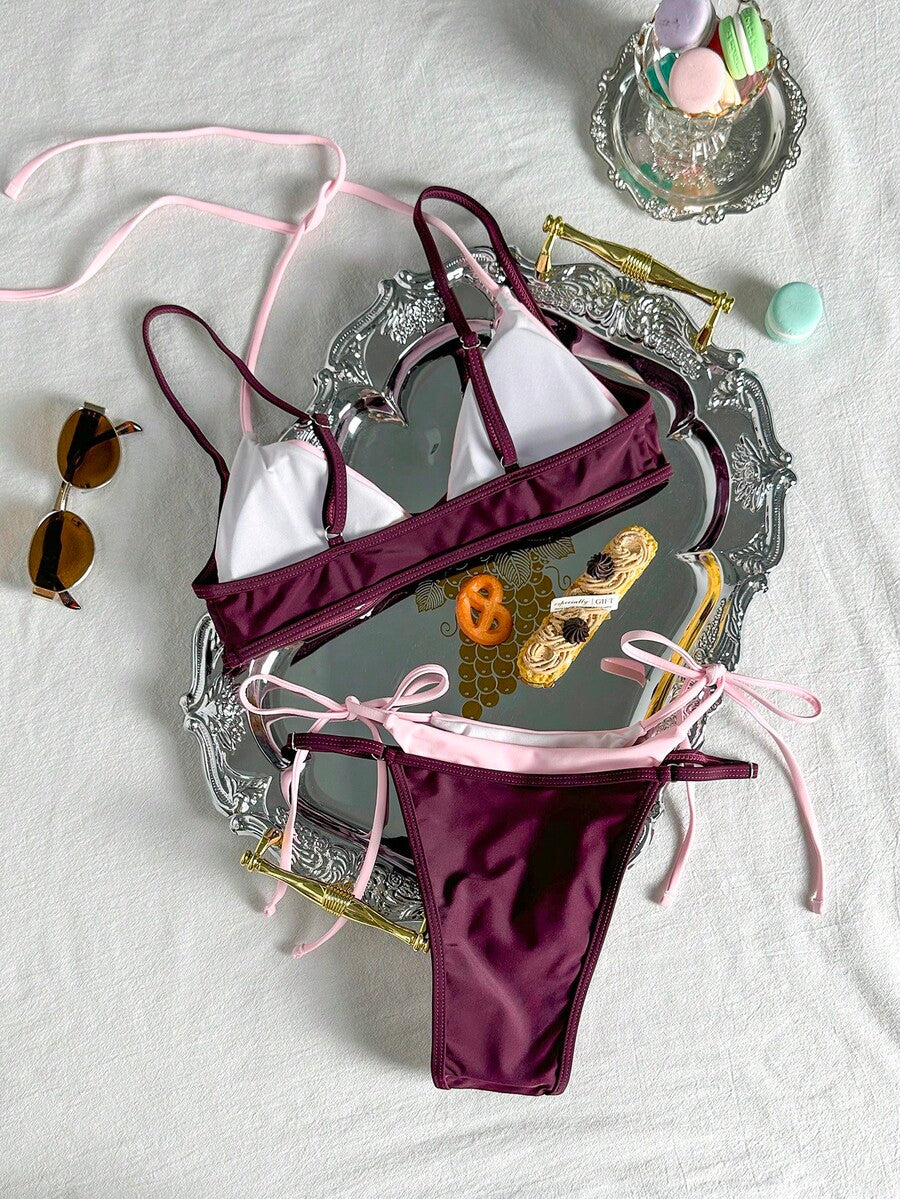 Women's retro polka dot high waist bikini swimsuit set with spaghetti straps and knot tie-back top.