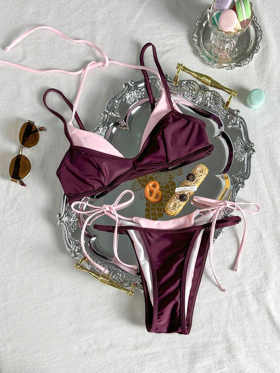 Women's retro polka dot high waist bikini swimsuit set with spaghetti straps and knot tie-back top.
