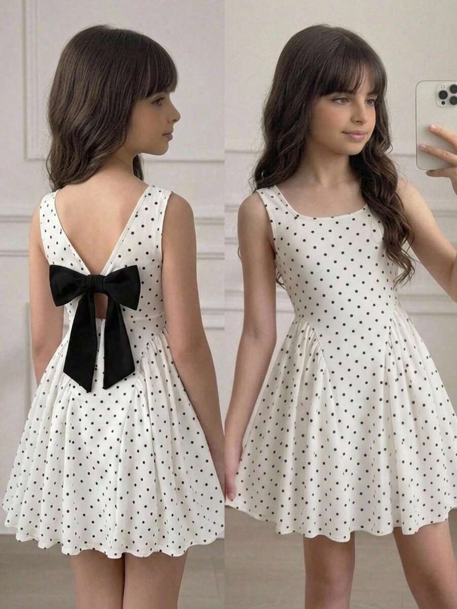 Black and white polka dot sleeveless A-line dress for tween girls featuring a scoop neck, high waist, and flared hem.