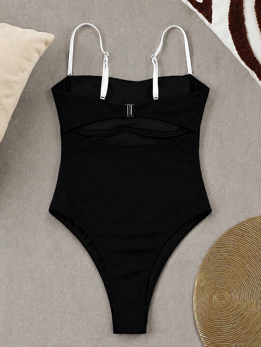 Black colorblock women's one-piece swimsuit with spaghetti straps and high stretch fabric.