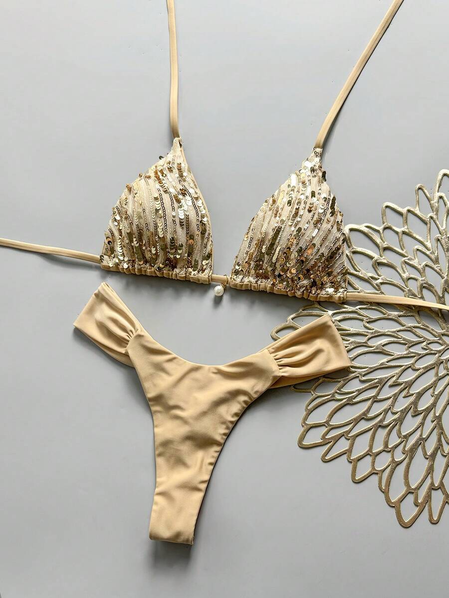 Women's 2-piece triangle cup bikini set in solid color featuring woven pearl shell decoration, halter neckline, and high-waist side-tie ruched bottoms.