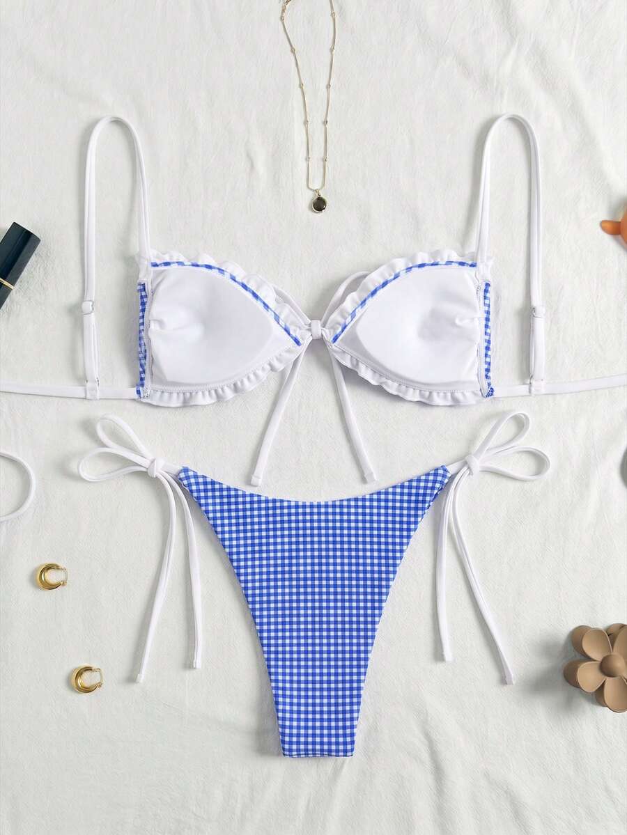 Women's beige two-piece bikini set featuring a wireless top with removable padding, spaghetti straps, tie back detail, and low waist hipster swimsuit bottoms.