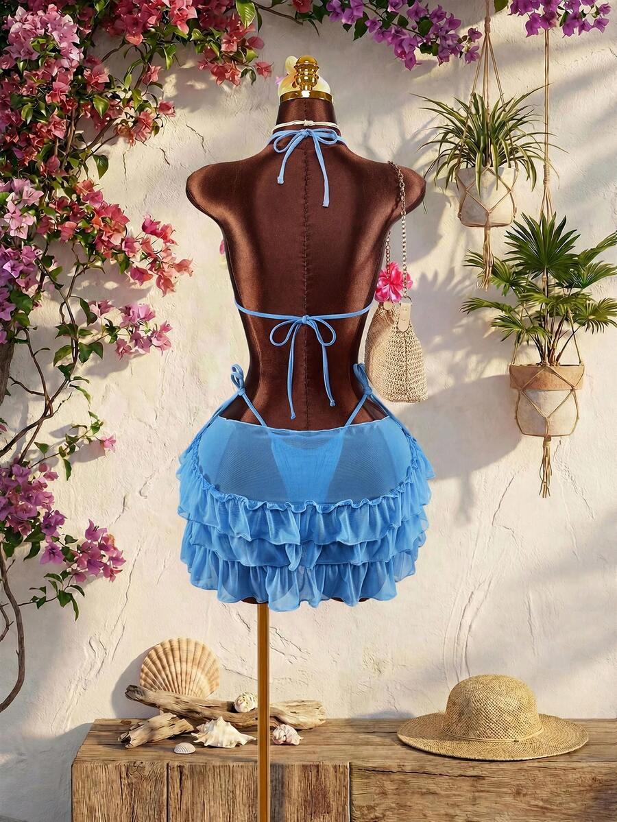 Women's 3-piece blue bikini swimwear set featuring a crop top with 3D rose accents, tie back detail, spaghetti straps, and tie-side bottoms.