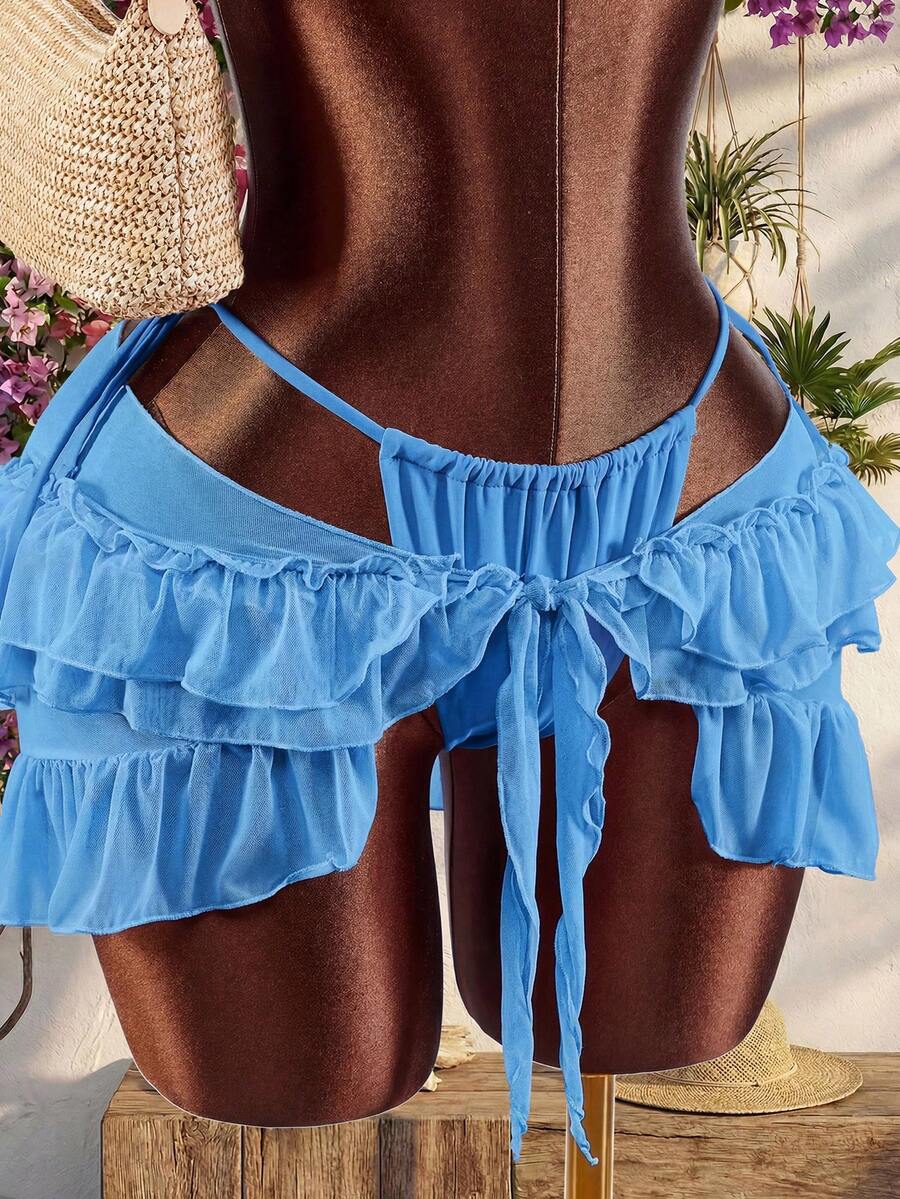 Women's 3-piece blue bikini swimwear set featuring a crop top with 3D rose accents, tie back detail, spaghetti straps, and tie-side bottoms.
