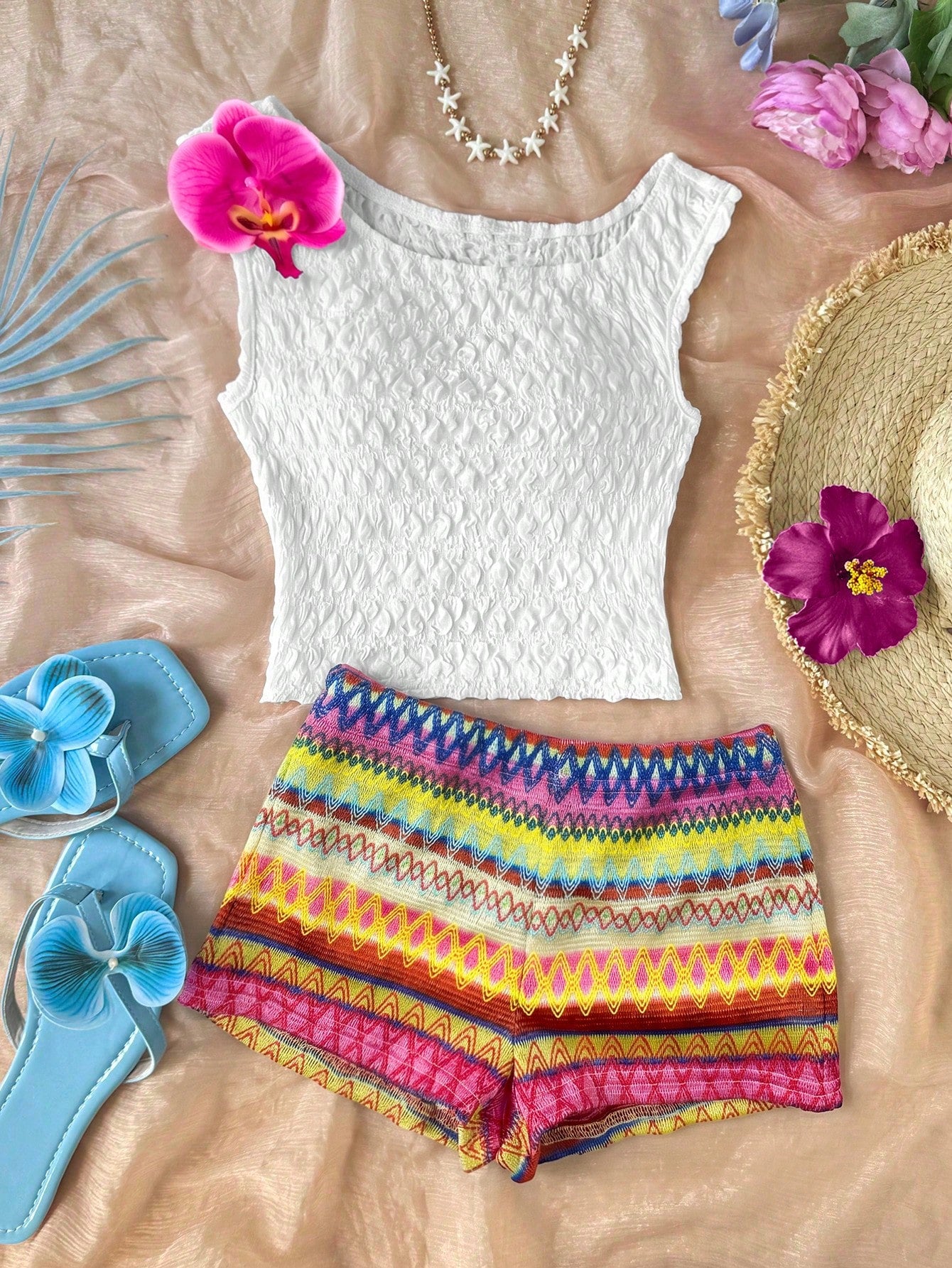 Tween girls 2-piece summer clothing set featuring a black asymmetric rib-knit striped off-shoulder t-shirt and matching slim fit shorts.