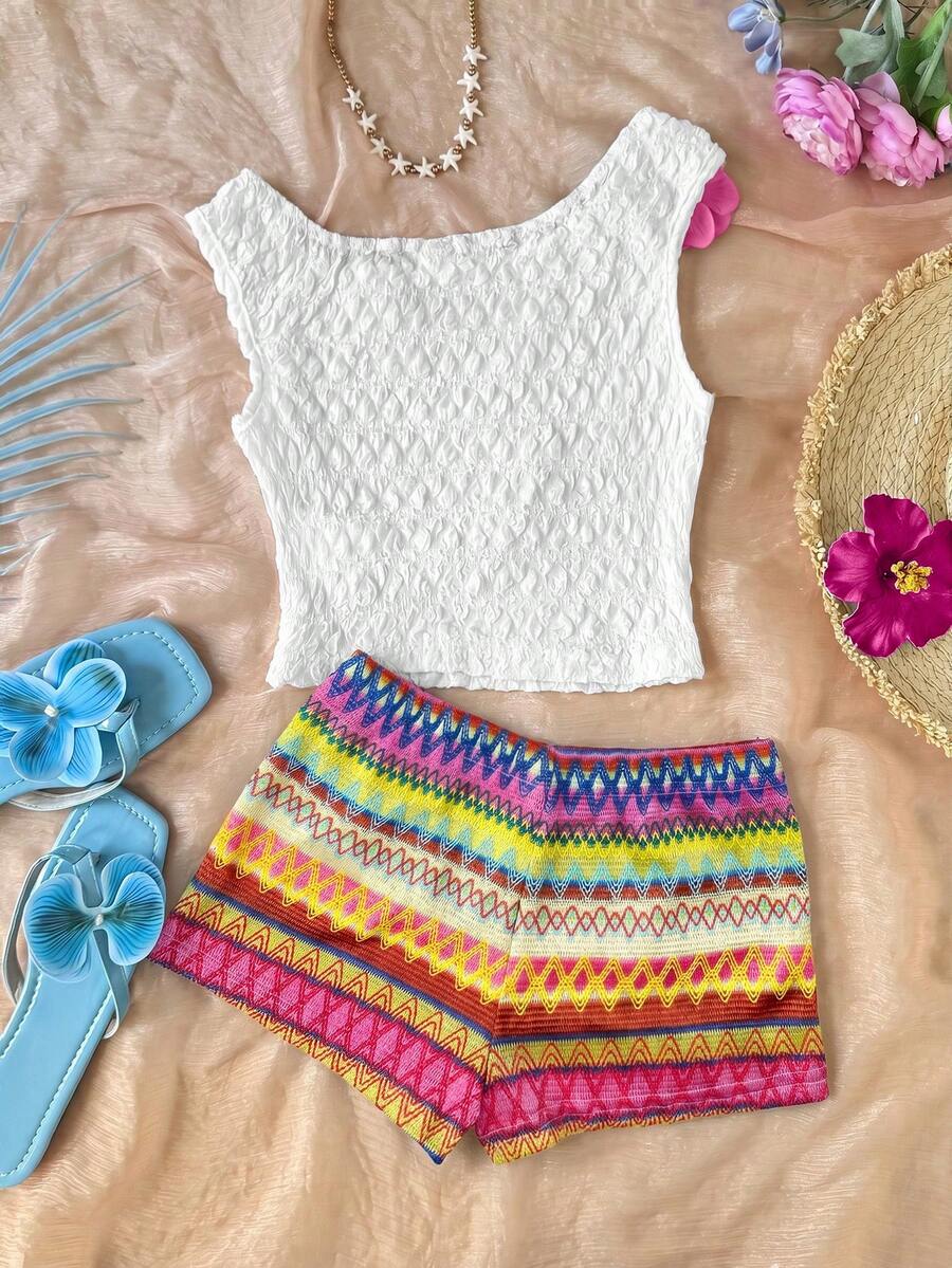 Tween girls 2-piece summer clothing set featuring a black asymmetric rib-knit striped off-shoulder t-shirt and matching slim fit shorts.