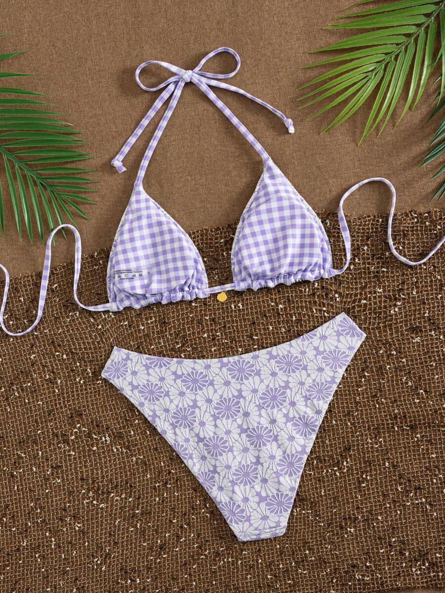 Women's black textured plaid 2-piece bikini set featuring a halter neckline, wireless triangle cups with removable padding, and mid-waist bottoms.