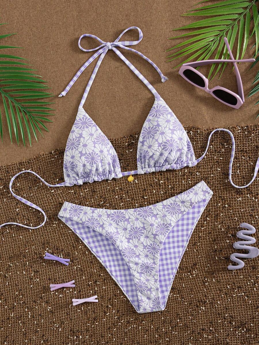 Women's black textured plaid 2-piece bikini set featuring a halter neckline, wireless triangle cups with removable padding, and mid-waist bottoms.