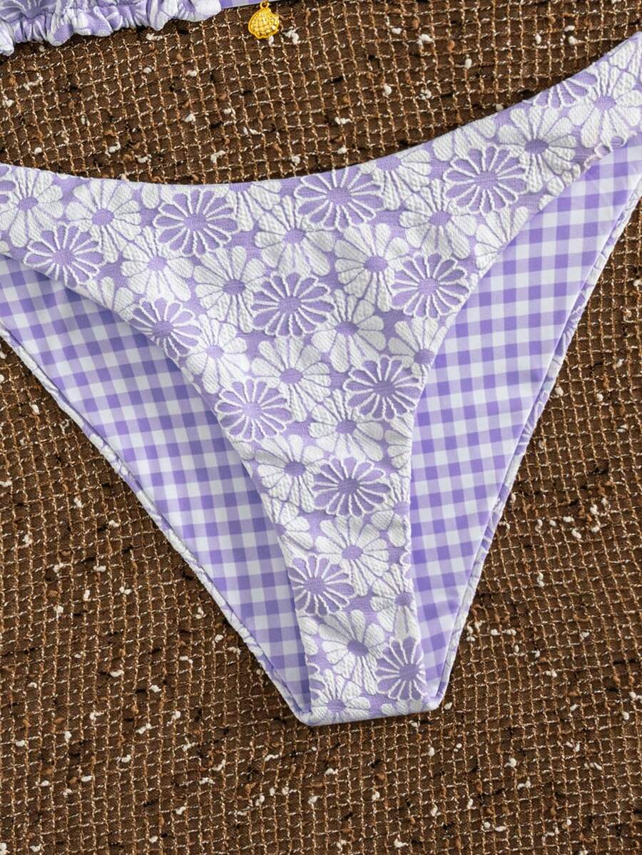 Women's black textured plaid 2-piece bikini set featuring a halter neckline, wireless triangle cups with removable padding, and mid-waist bottoms.