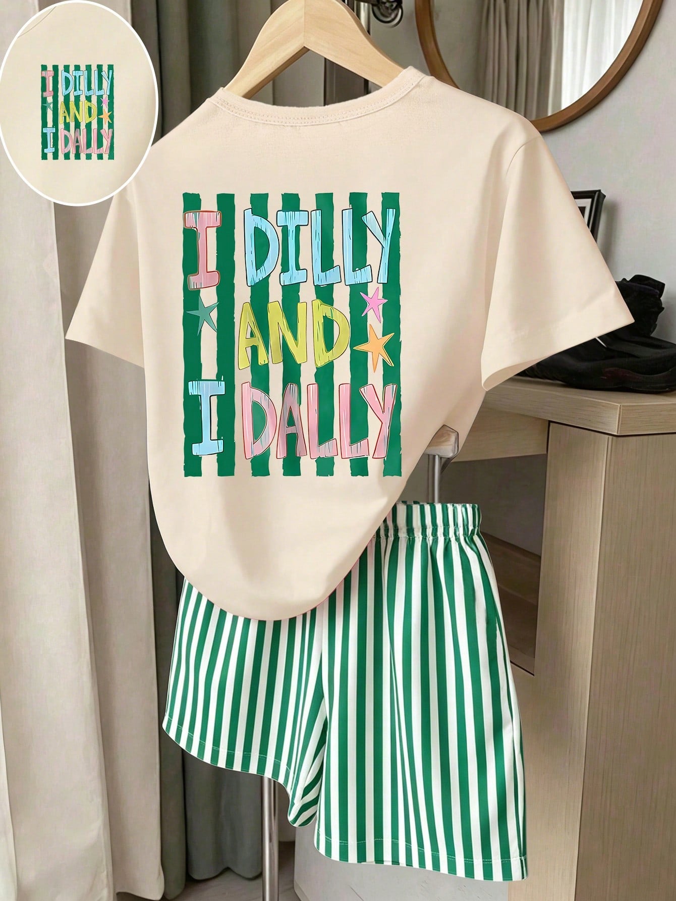 Girls' multicolor short sleeve T-shirt and shorts set featuring a cute cherry and bow print with round neck top and matching shorts.