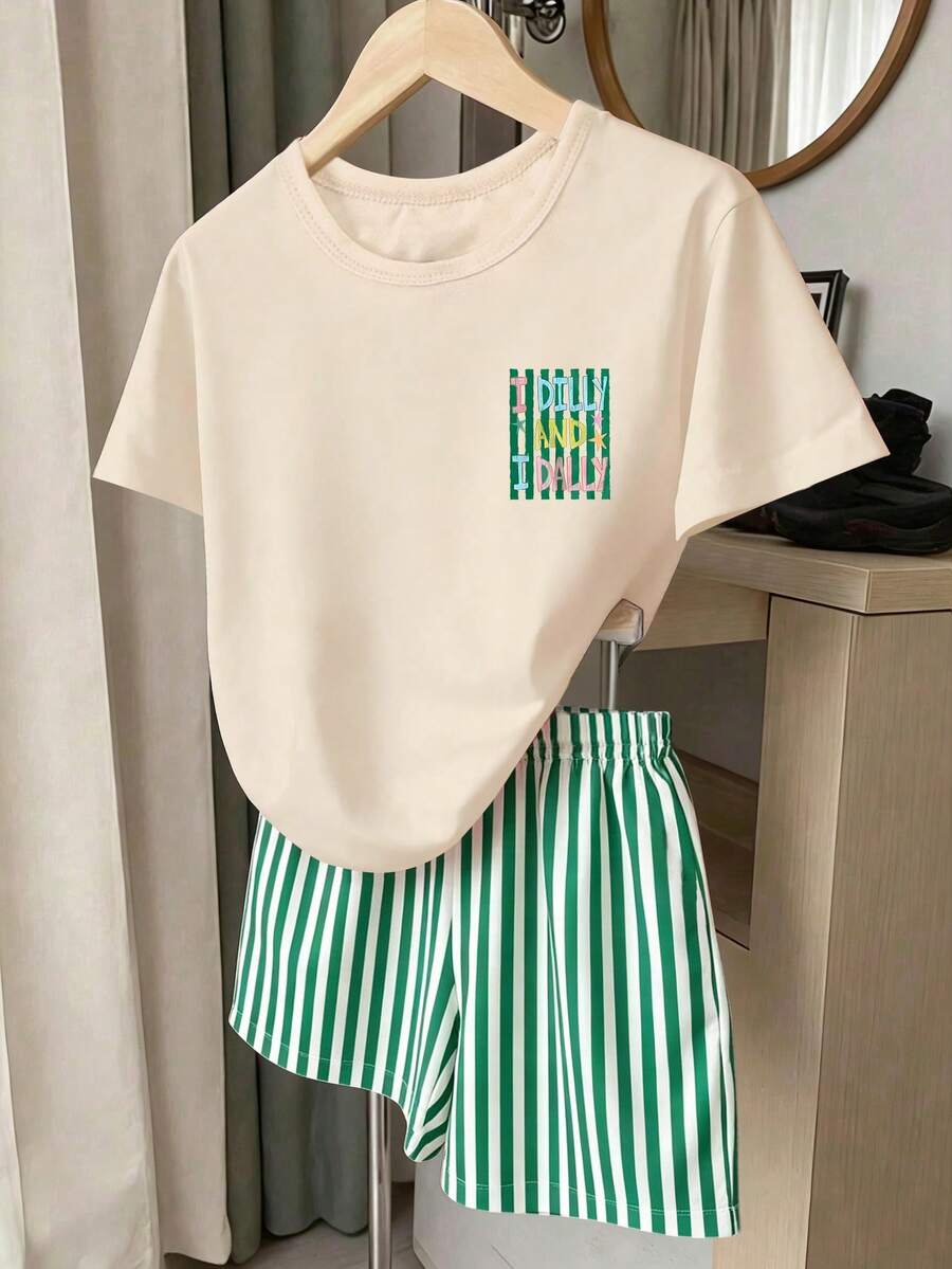 Girls' multicolor short sleeve T-shirt and shorts set featuring a cute cherry and bow print with round neck top and matching shorts.