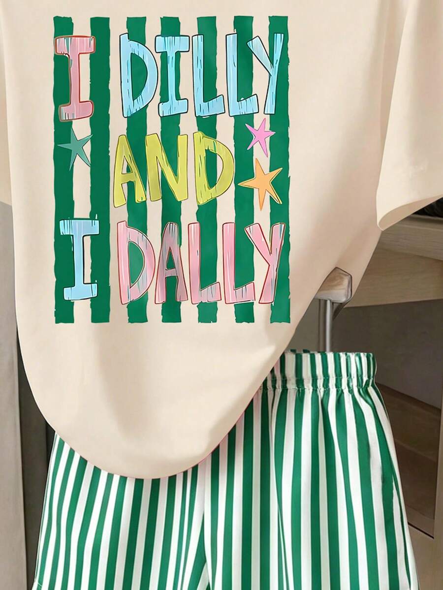 Girls' multicolor short sleeve T-shirt and shorts set featuring a cute cherry and bow print with round neck top and matching shorts.