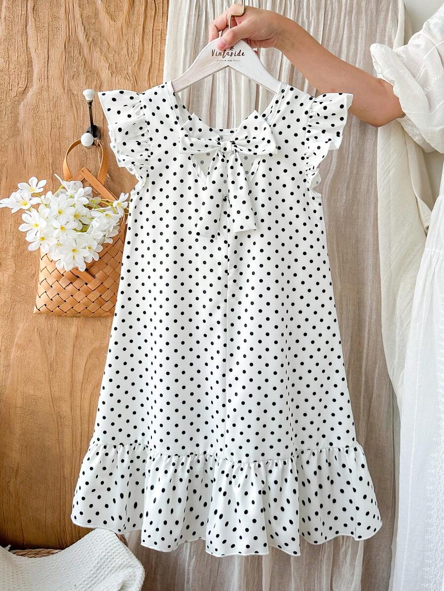 Tween girls apricot vacation midi dress featuring a round neck, cut out details, ruffle flounce accents, and geometric pattern.
