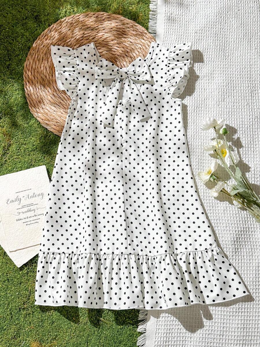 Tween girls apricot vacation midi dress featuring a round neck, cut out details, ruffle flounce accents, and geometric pattern.