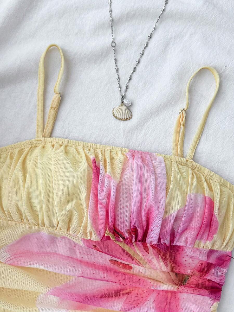 Yellow sleeveless tween girls cami dress with spaghetti straps, ruched bust, shirred details, high waist, and flared short A-line hem for vacation wear.